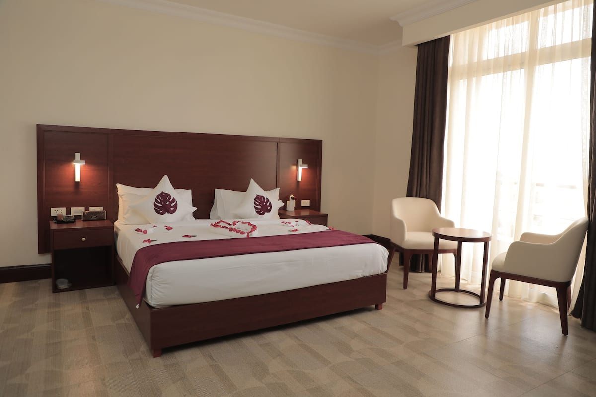Standard Double Room | 1 bedroom, in-room safe, individually furnished, blackout drapes