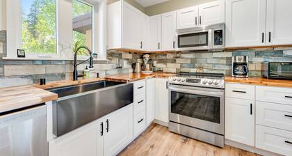 Two-story dog-friendly getaway with WiFi, wood-burning fireplace, & washer/dryer