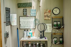 Cozy retreat with a desk, chair, and shelf for personal touches.