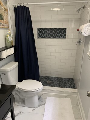Combined shower/tub, hair dryer, towels, soap