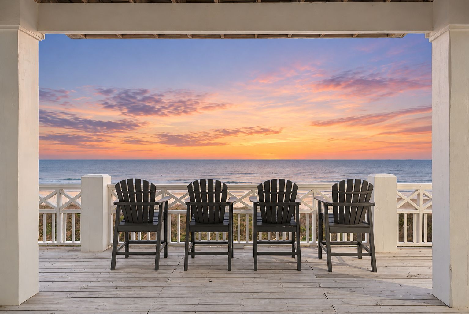 Welcome to Paradise Pointe! Private beachfront balcony with Adirondack chairs and breathtaking Gulf sunset views.