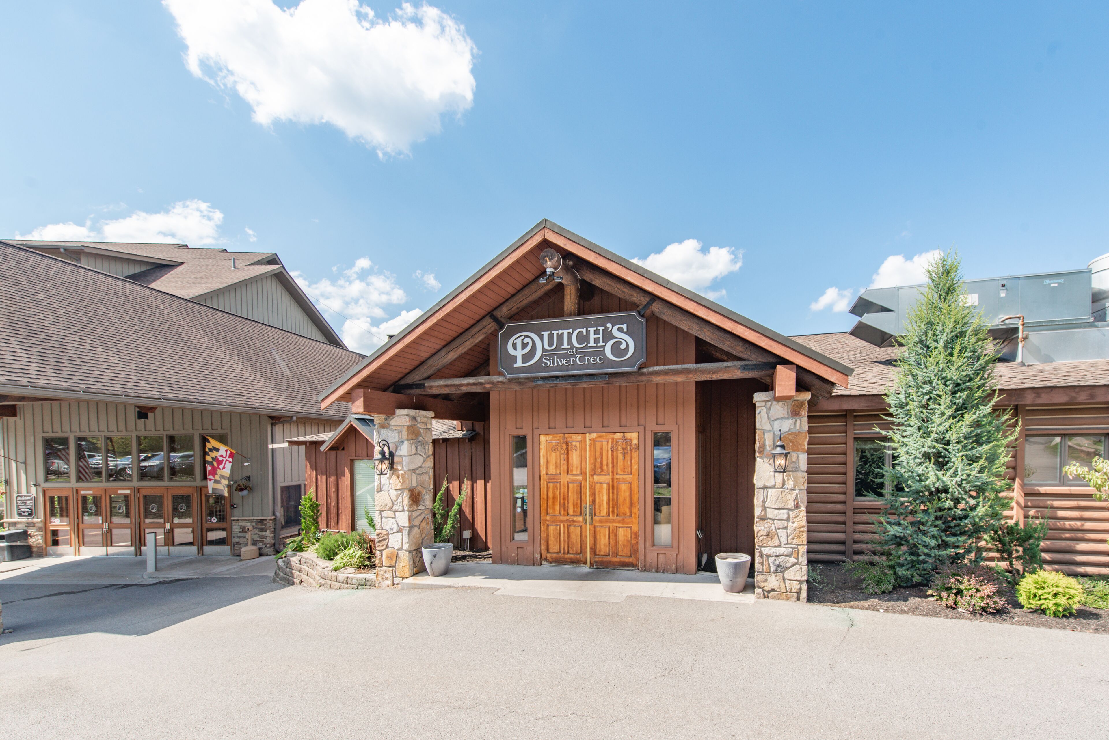 A wooden building with a sign reading "Dutch's at Silver Creek."