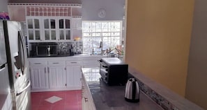 Fridge, microwave, stovetop, coffee/tea maker