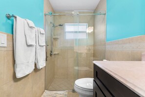 Combined shower/bathtub, hair dryer, towels, soap