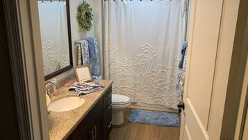 Combined shower/tub, towels, soap, shampoo