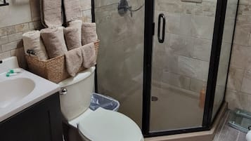 Shower, towels, soap, toilet paper