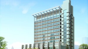 A modern high-rise building with a glass facade and a unique architectural design. - Donghua Hotel (Zherong)