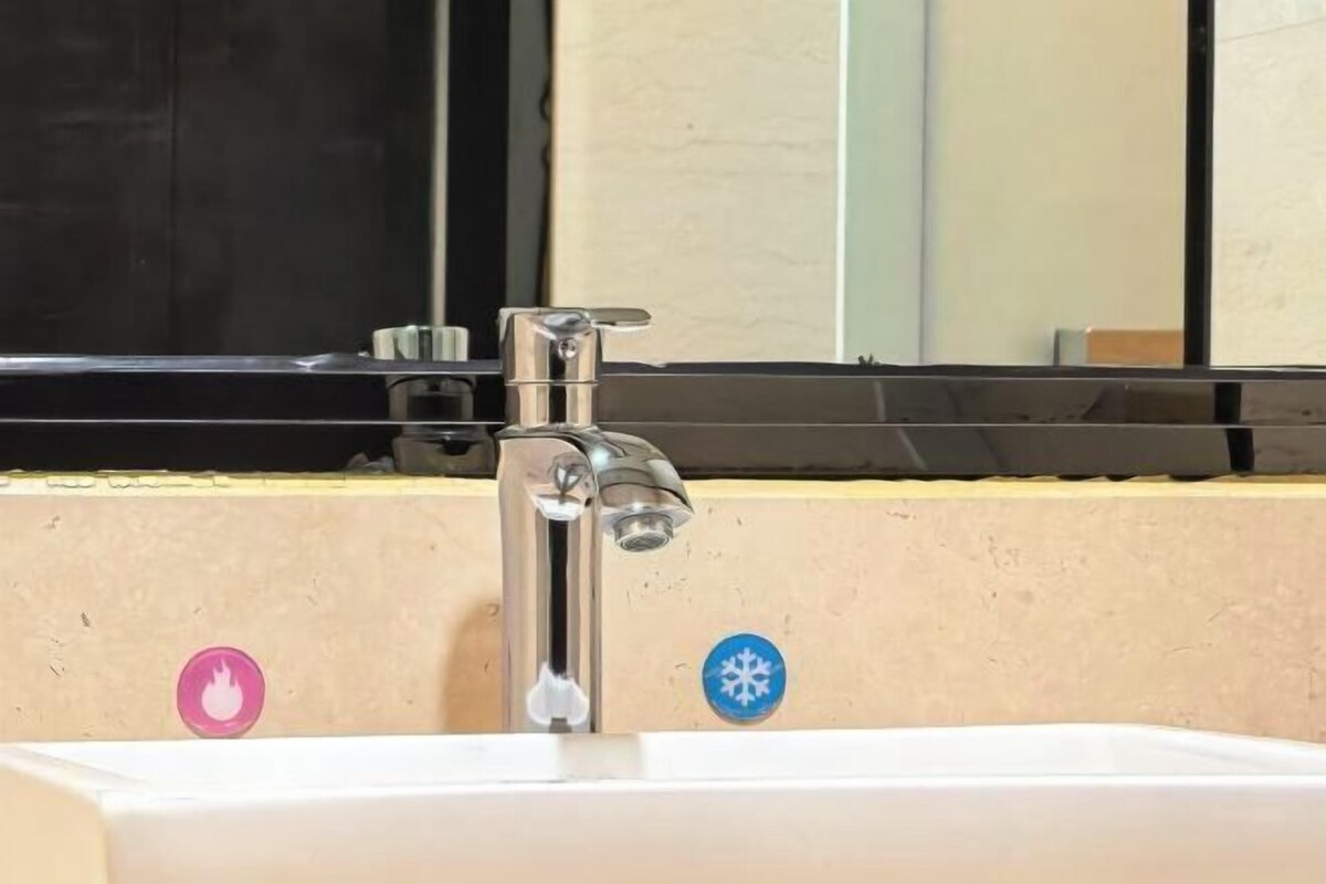 A bathroom sink with a mirror above it.