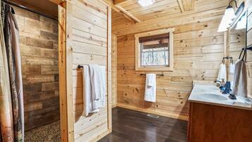 Combined shower/bathtub, towels, soap, toilet paper