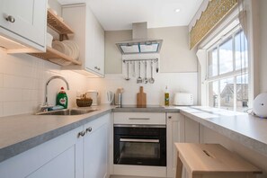 Fridge, microwave, cookware/dishes/utensils