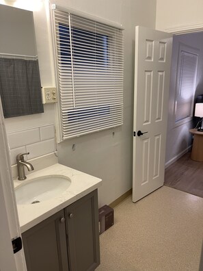Combined shower/tub, hair dryer, towels, soap