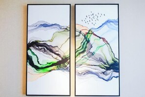 Two abstract paintings with flowing lines and shapes.