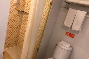 A bathroom with a shower, toilet, and towel rack. - Pebble Motel (Jianhu Bus Station) (Jianhu)