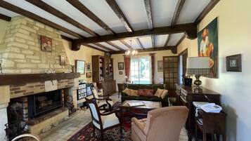 TV, fireplace, books, printers