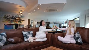 A modern living room with two sofas, a coffee table, and a mural on the wall. - The Bling Hotel by UStay (Liverpool)