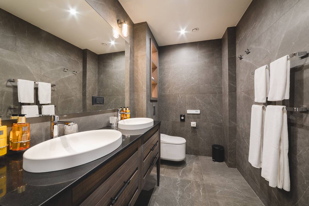 executive suite, 1 king bed with sofa bed | bathroom | shower, rainfall showerhead, designer toiletries, hair dryer