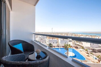 You'll have beautiful bay & ocean views & a glimpse of one of the pools below too!