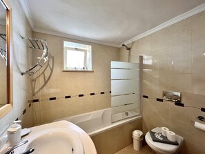 Bathtub, hair dryer, towels