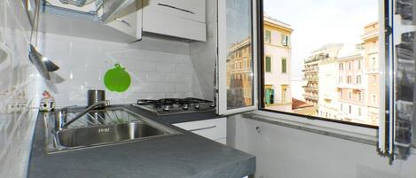 Fridge, microwave, stovetop, coffee/tea maker