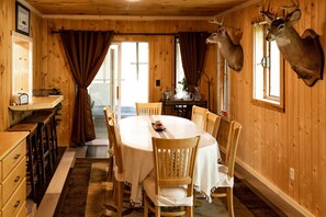 Enjoy meals in this charming room with a round dining table and comfortable seating for six.