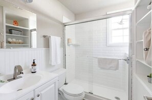 Shower, hair dryer, towels, soap