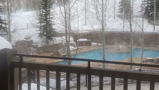 A snowy landscape with a pool and trees. - Four Seasons Jackson Hole 3-Bedroom March 26 to April 2 Skin-In/out Negotiable (Teton Village)