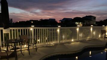 Outdoor pool, a heated pool, pool umbrellas, pool loungers