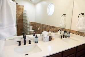 Bathtub, hair dryer, towels, soap