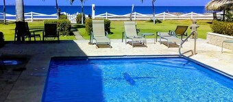 Beachfront one-bedroom, ocean view condo with toes in the sand!