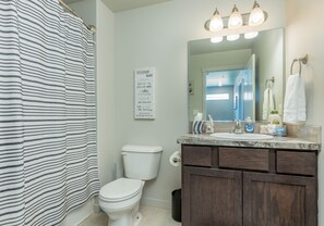 Combined shower/tub, shampoo