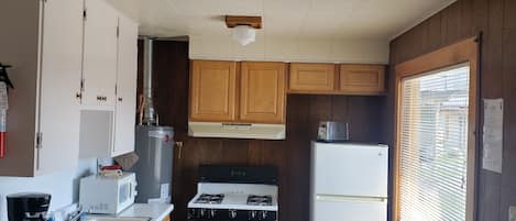 Basic Cabin | Private kitchen | Full-size fridge, microwave, oven, stovetop