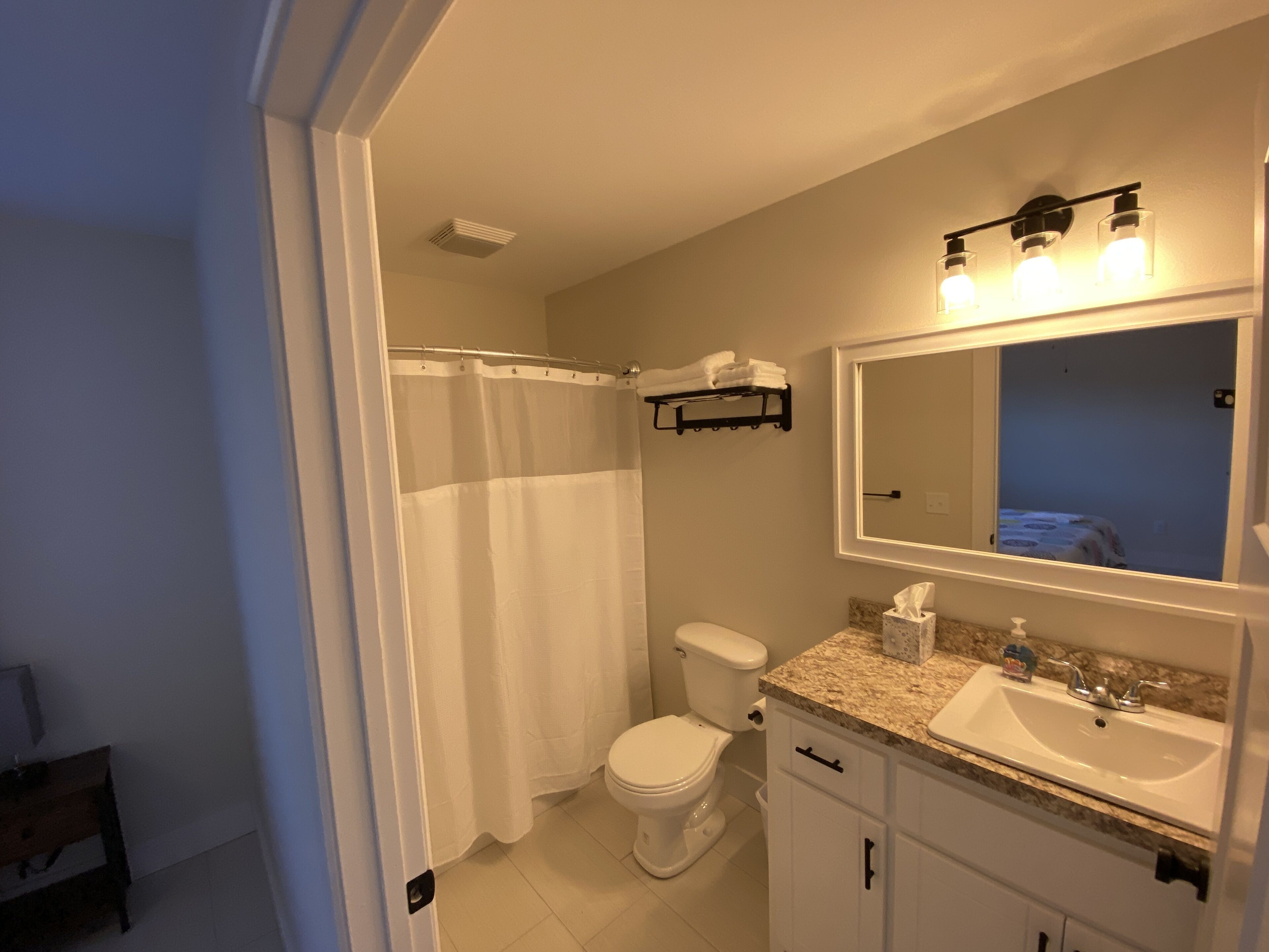 Combined shower/tub, hair dryer, towels, soap