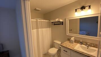 Combined shower/tub, hair dryer, towels, soap