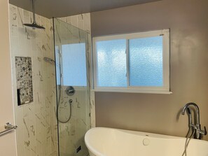 Bathtub, hair dryer, towels, soap