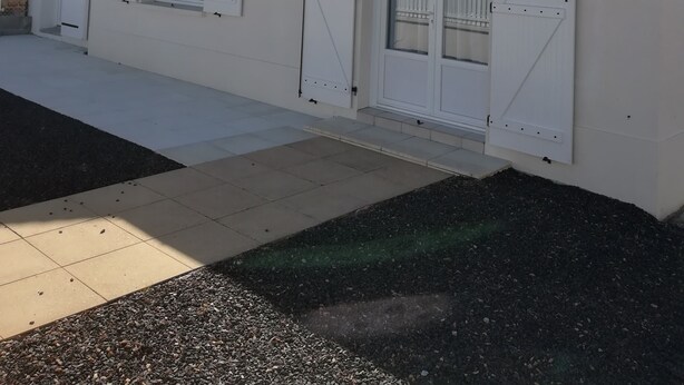 A white building with a tiled roof, multiple windows, and a door. - Vacation home close to the beach (La Faute-sur-Mer)