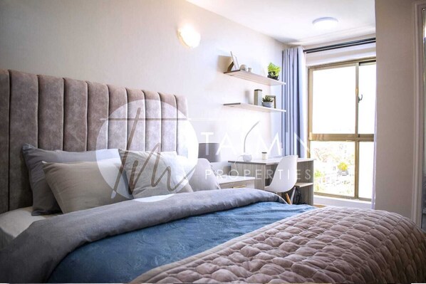 1 غرفة نوم ومكواة/لوح كي وواي فاي وملاءات أسرّة