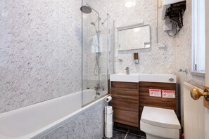 Combined shower/tub, hair dryer, towels, soap
