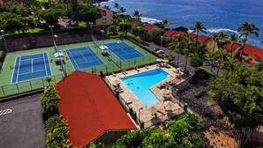 A resort with multiple tennis courts, a swimming pool, and a view of the ocean. - KKSR#2304 DIRECT OCEANFRONT, INCREDIBLE TOP FLOOR CORNER UNIT, HUGE LANAI! (Kailua Kona)