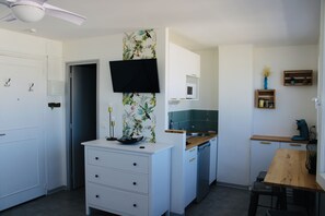 Fridge, microwave, stovetop, coffee/tea maker