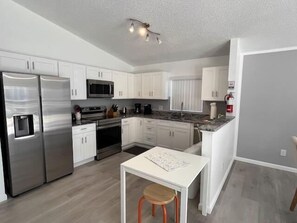 Fridge, microwave, oven, stovetop - Cozy 4BR Home in Hampton Lakes, Pool & Games Room! (Davenport)