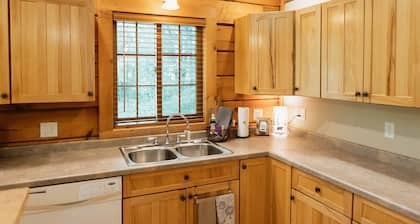 Genuine Log Cabin with large yard in a small quaint town across from Fish Lake