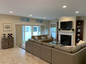 Smart TV, fireplace, books, printers