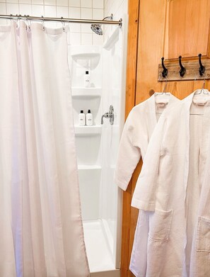 Bathtub, hair dryer, towels, soap