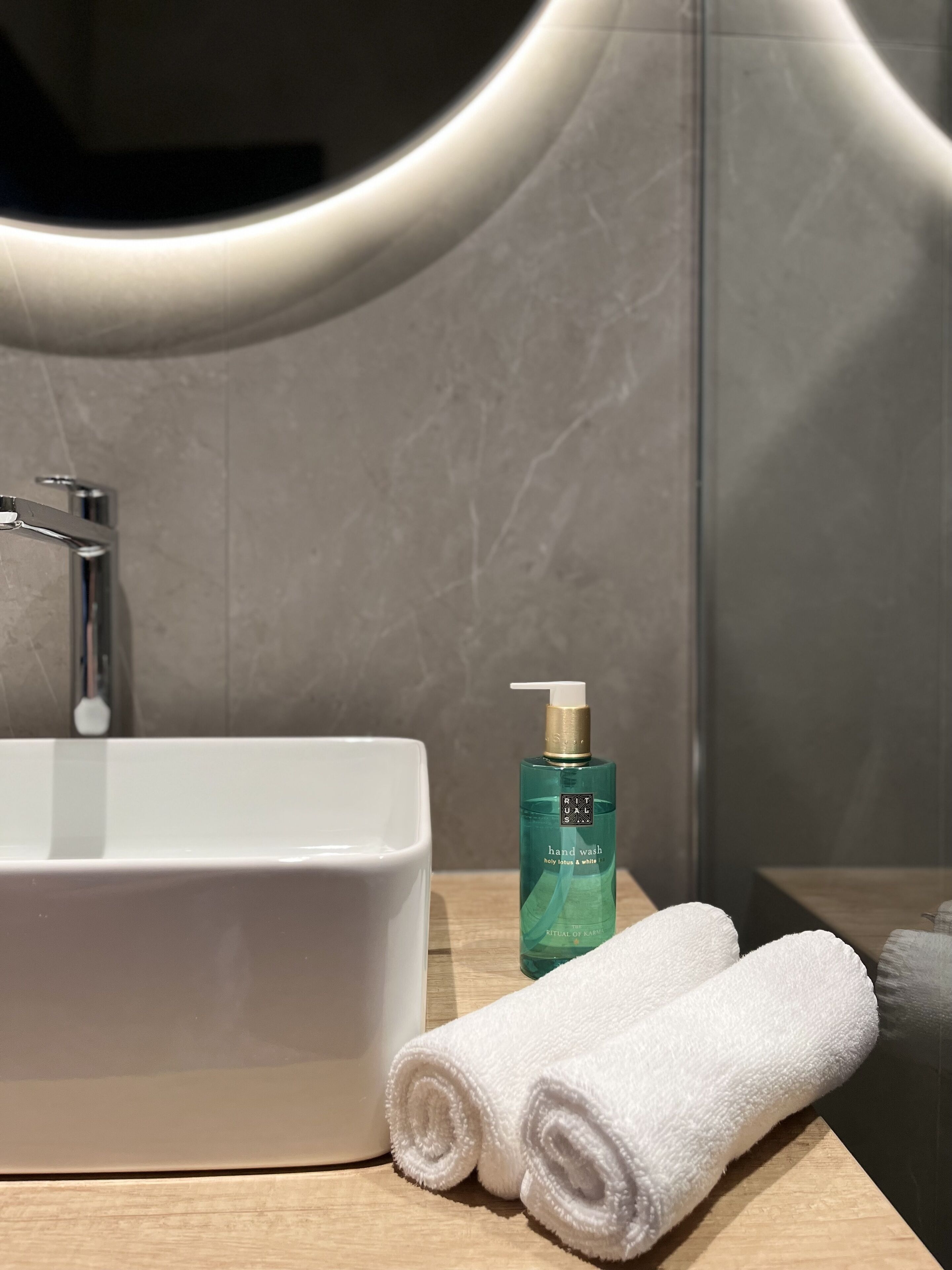 Shower, rainfall showerhead, designer toiletries, hair dryer