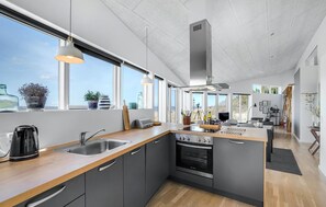 Fridge, stovetop, dishwasher, coffee/tea maker