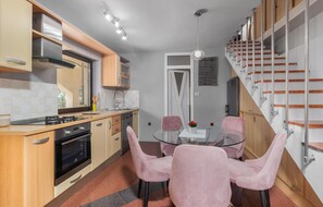 Enjoy cooking in this well-equipped kitchen with a central island and dining area.