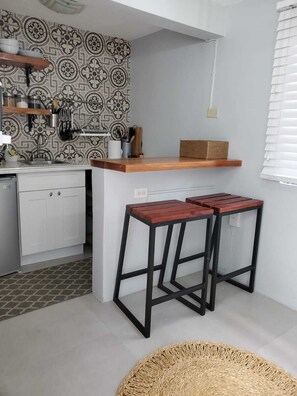 Fridge, microwave, stovetop, coffee/tea maker