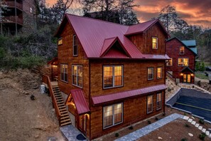 Situated in a mountainous area, this cabin offers a serene natural setting with a multi-level living space.