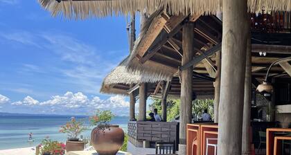 Spacious private and gated modern home within walking distance to beach/resorts.