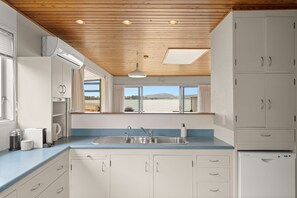 Family House | Private kitchen | Full-size fridge, microwave, oven, stovetop - Stay Tauranga Beach House (Tauranga)